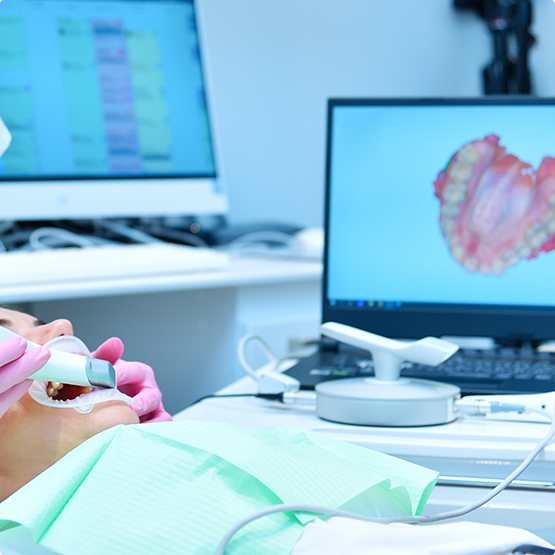 Dentist capturing digital impressions of a patient's teeth