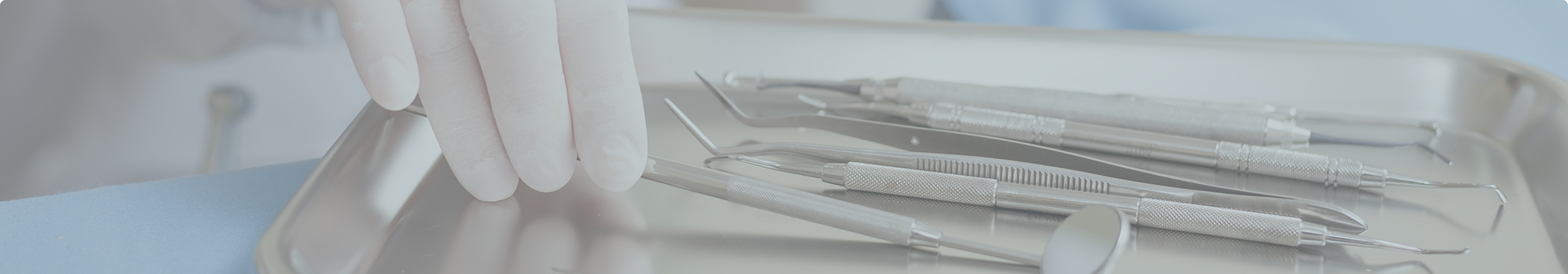 Dentist selecting a dental instrument