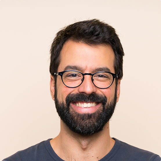 Smiling man with a black beard