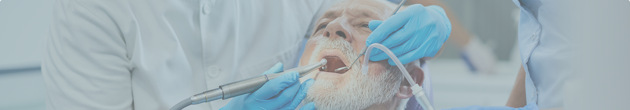 Older man receiving gum disease treatment in Tewksbury