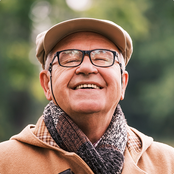 Senior man smiling outdoors