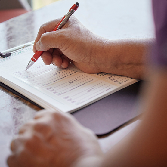 Person filling out a form