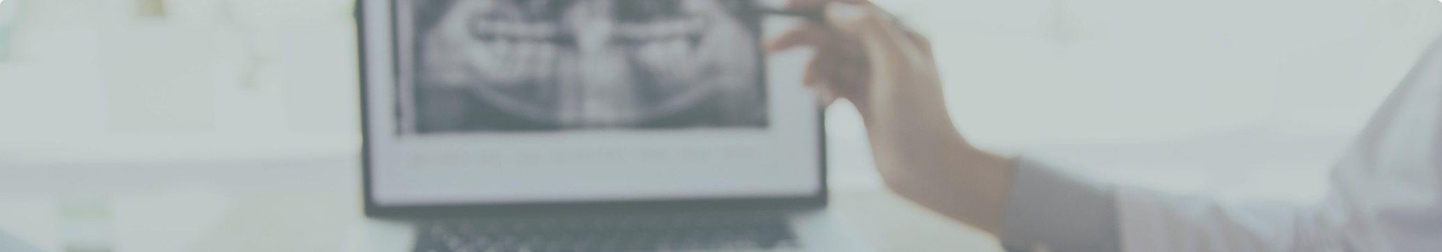 Dentist showing a patient an x-ray of their teeth